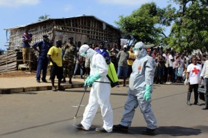 ebola_aidworkers_decontaminate-100525698-large.idge